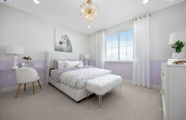 a bed room with a bed and a chair