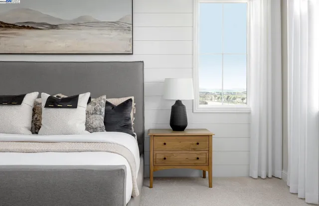 a bed room with a bed and a window