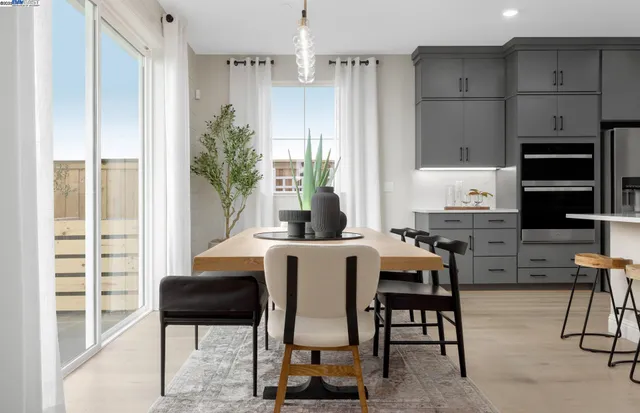 a dining room with furniture and window