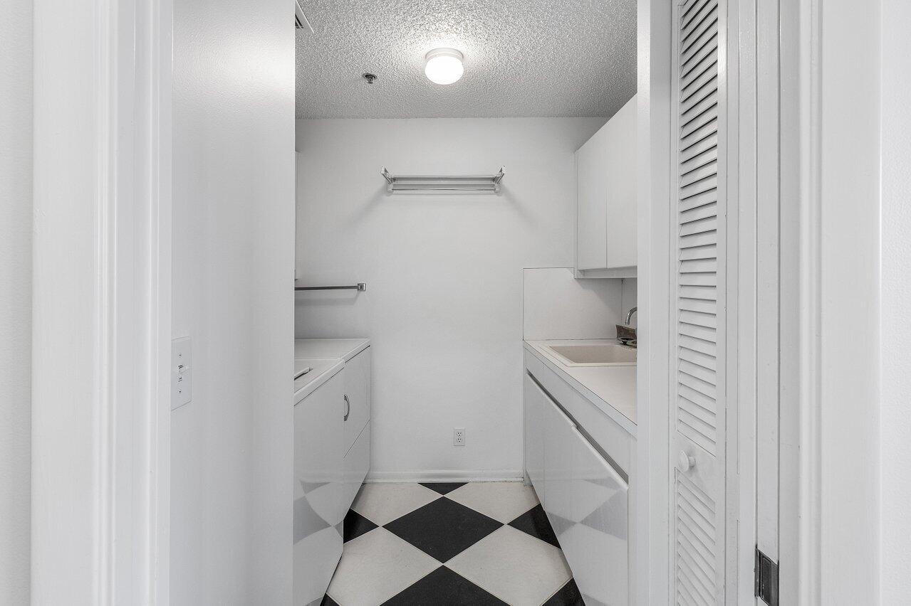 7351 Promenade Drive, Unit F702 Boca Raton, FL 33433 - Photo 22 of 34 Laundry Room
