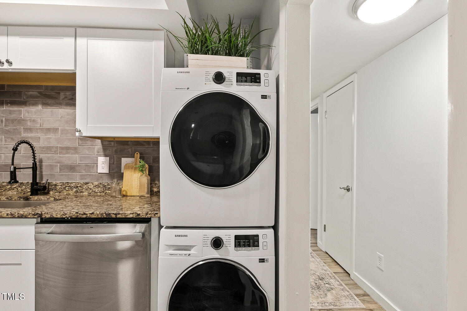 7002 Longstreet Drive, Unit C Raleigh, NC 27615 - Photo 11 of 31 a view of a kitchen with washer and dryer