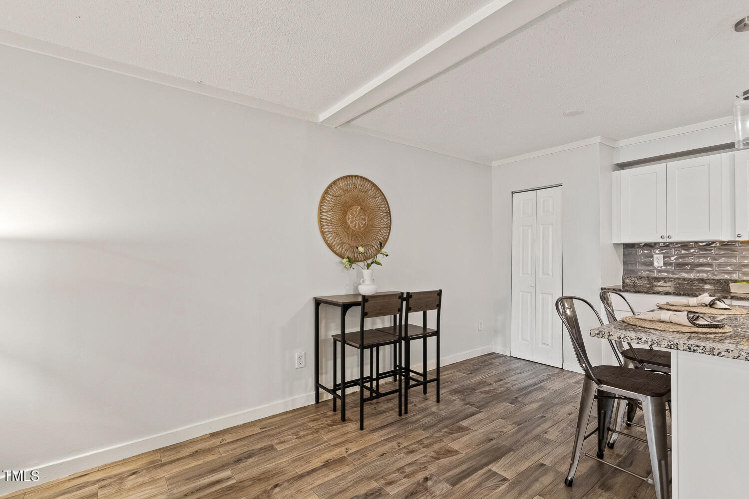 7002 Longstreet Drive, Unit C Raleigh, NC 27615 - Photo 15 of 31 a view of a dining room with furniture and wooden floor