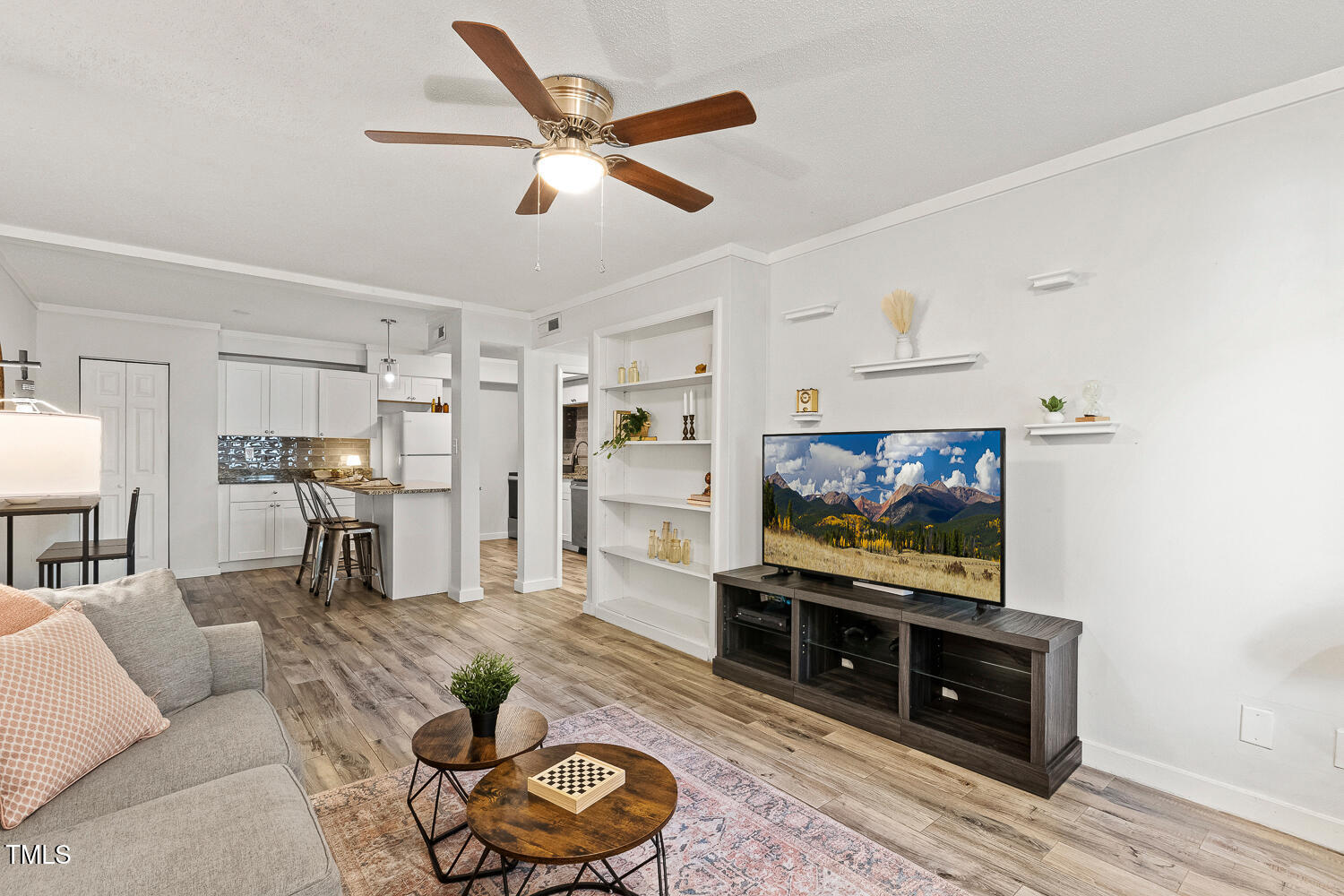 7002 Longstreet Drive, Unit C Raleigh, NC 27615 - Photo 7 of 31 a living room with furniture and a flat screen tv