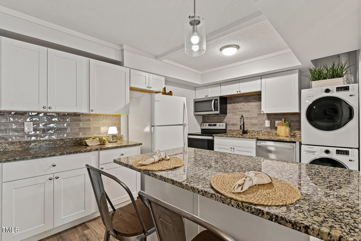 7002 Longstreet Drive, Unit C Raleigh, NC 27615 - Photo 9 of 31 a kitchen with granite countertop a sink appliances and cabinets