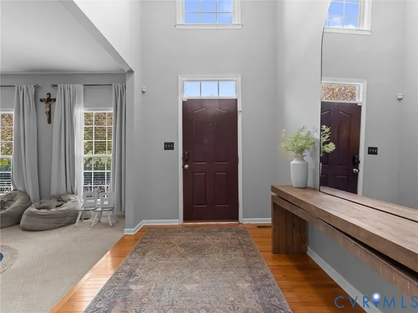 a view of living room with furniture and wooden floor