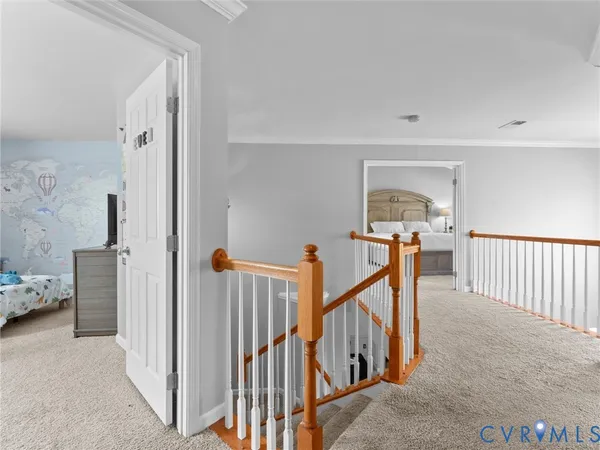 a bedroom with a bed and flat screen tv