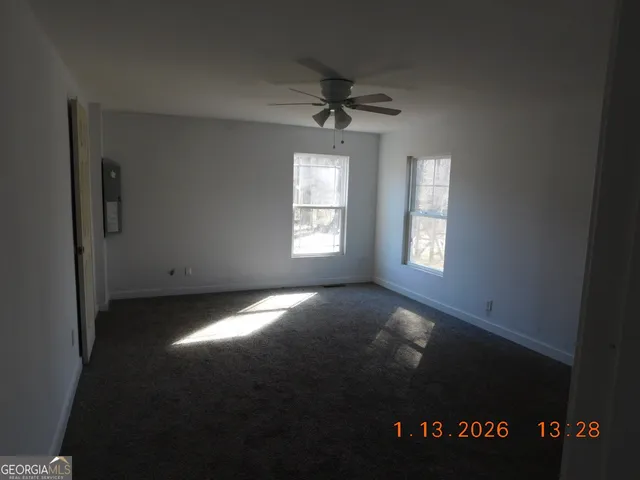 a bathroom with a tub and a window