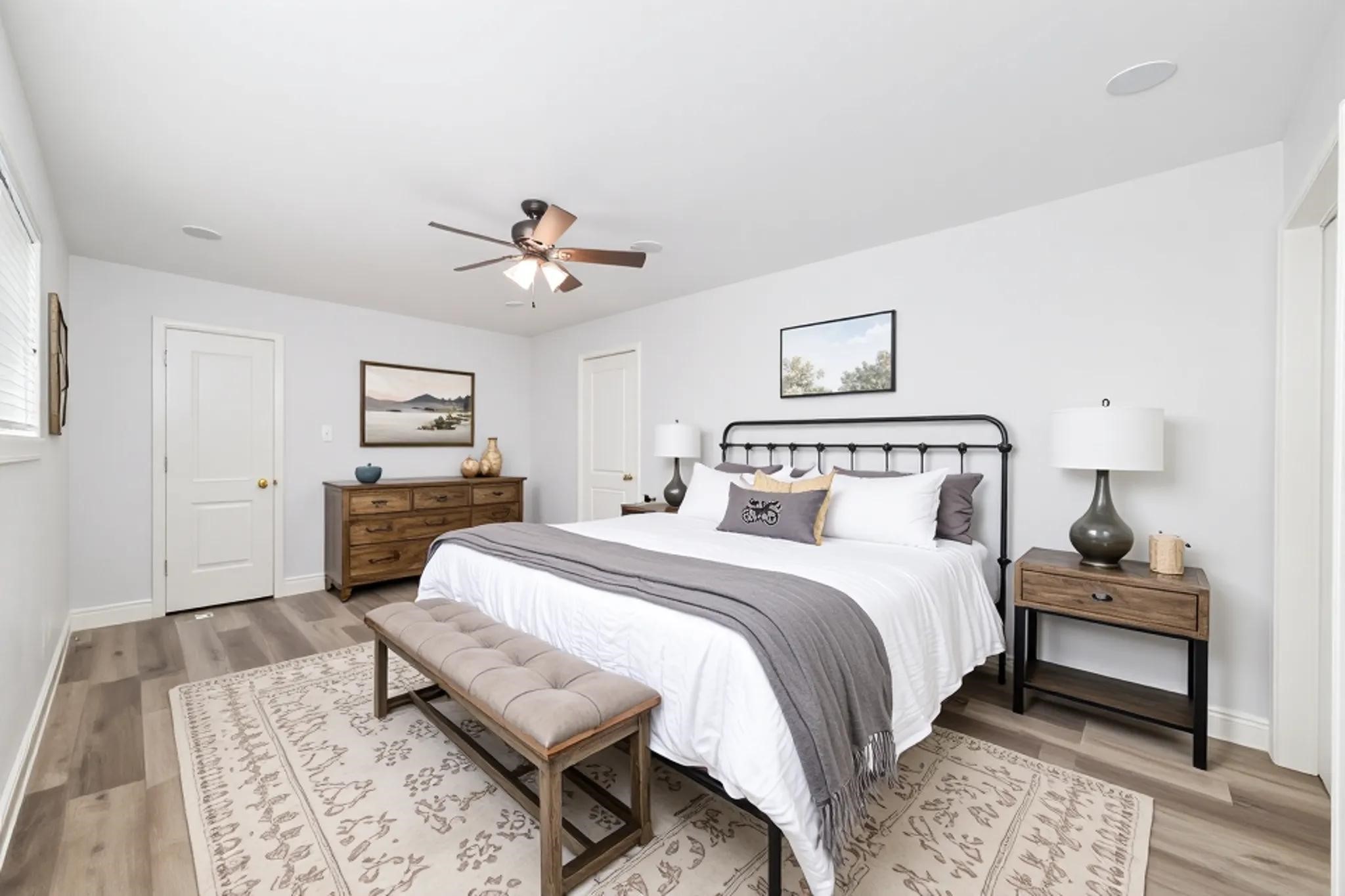 5922 Hummingbird Street Houston, TX 77096 - Photo 14 of 26 Privately positioned away from the secondary bedrooms, the primary suite offers a peaceful retreat at the end of the day. The spacious layout easily accommodates a king-size bed while maintaining an open, relaxing feel. (VS)