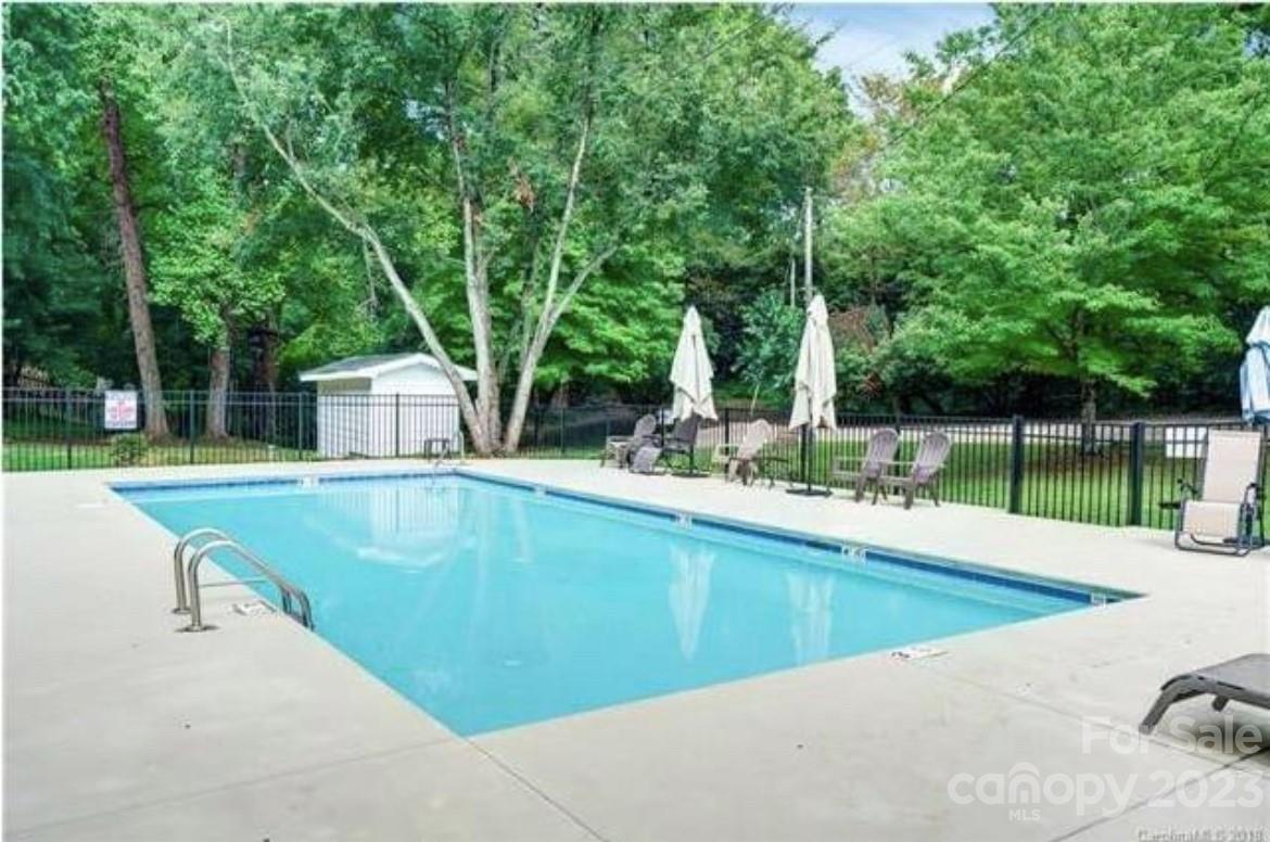 228 Providence Road Charlotte, NC 28207 - Photo 14 of 16 a view of a swimming pool with a patio