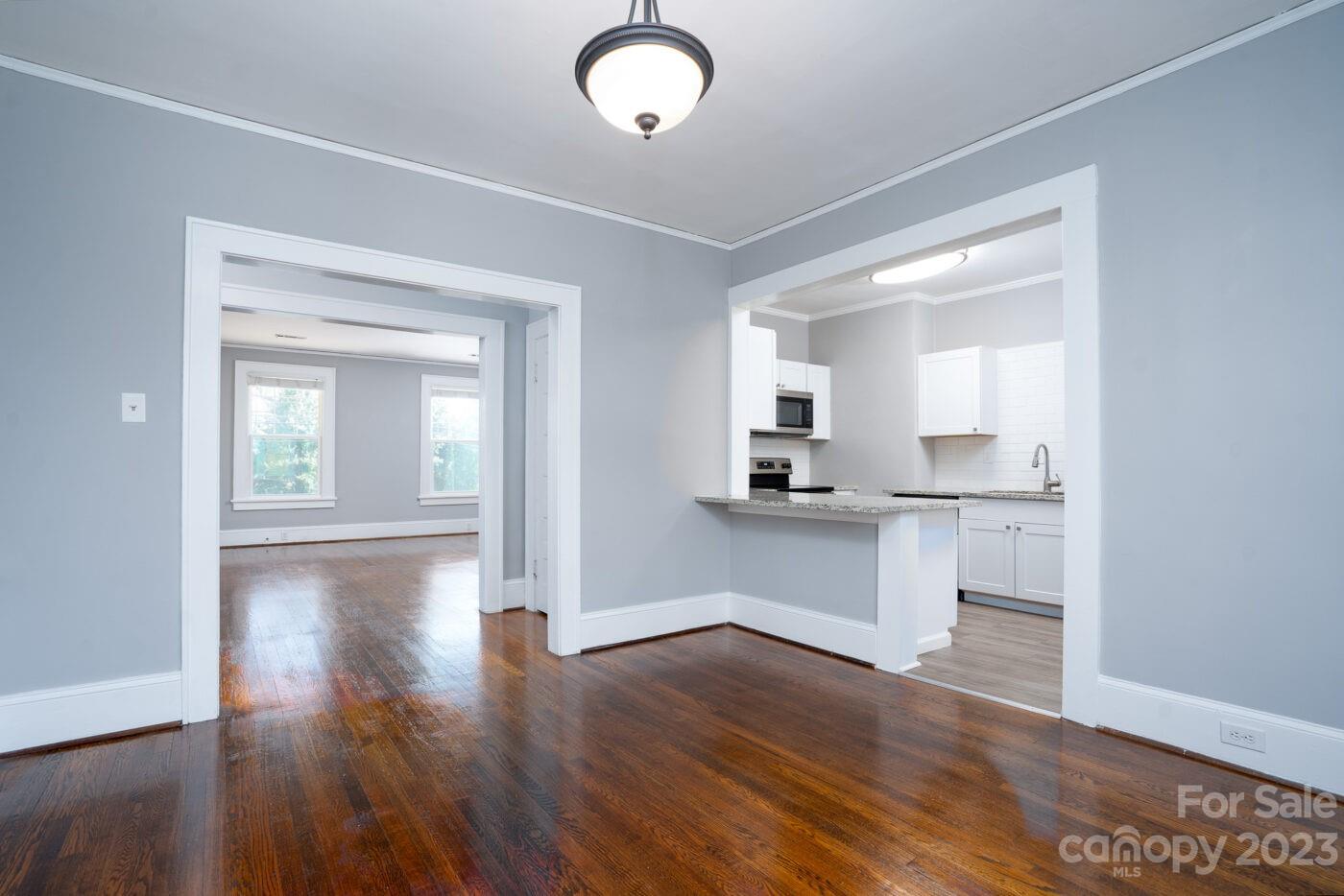 228 Providence Road Charlotte, NC 28207 - Photo 7 of 16 a view of kitchen with wooden floor