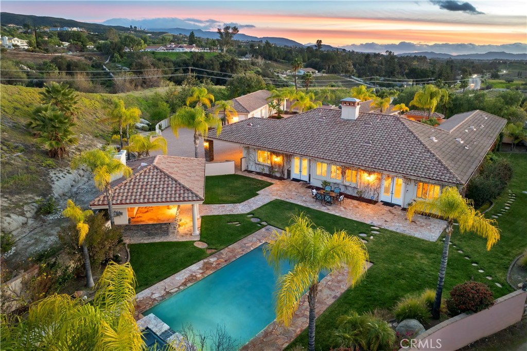 swimming pool view with a lake view