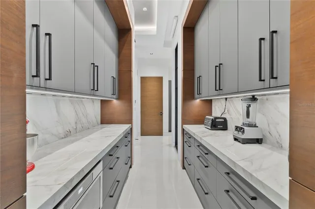 a kitchen with cabinets and a sink