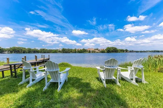 a view of a lake with houses in the back