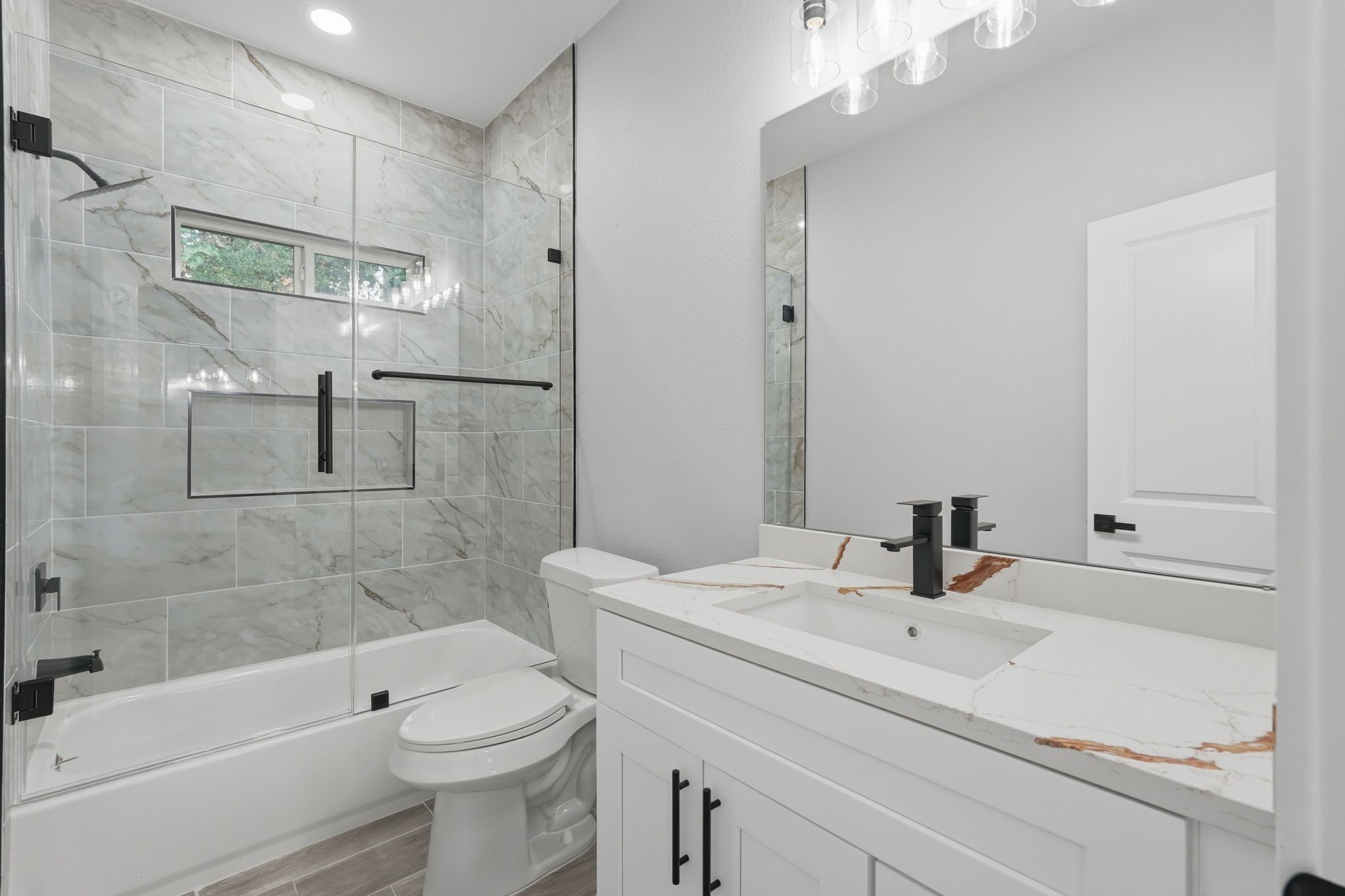 3575 Roy Bean Road Willis, TX 77378 - Photo 30 of 40 a bathroom with a sink a toilet and shower
