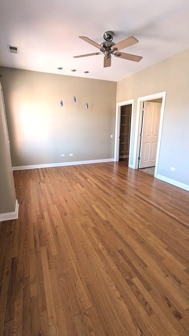 1355 West Washington Boulevard, Unit 6B Chicago, IL 60607 - Photo 12 of 28 a view of an empty room and wooden floor