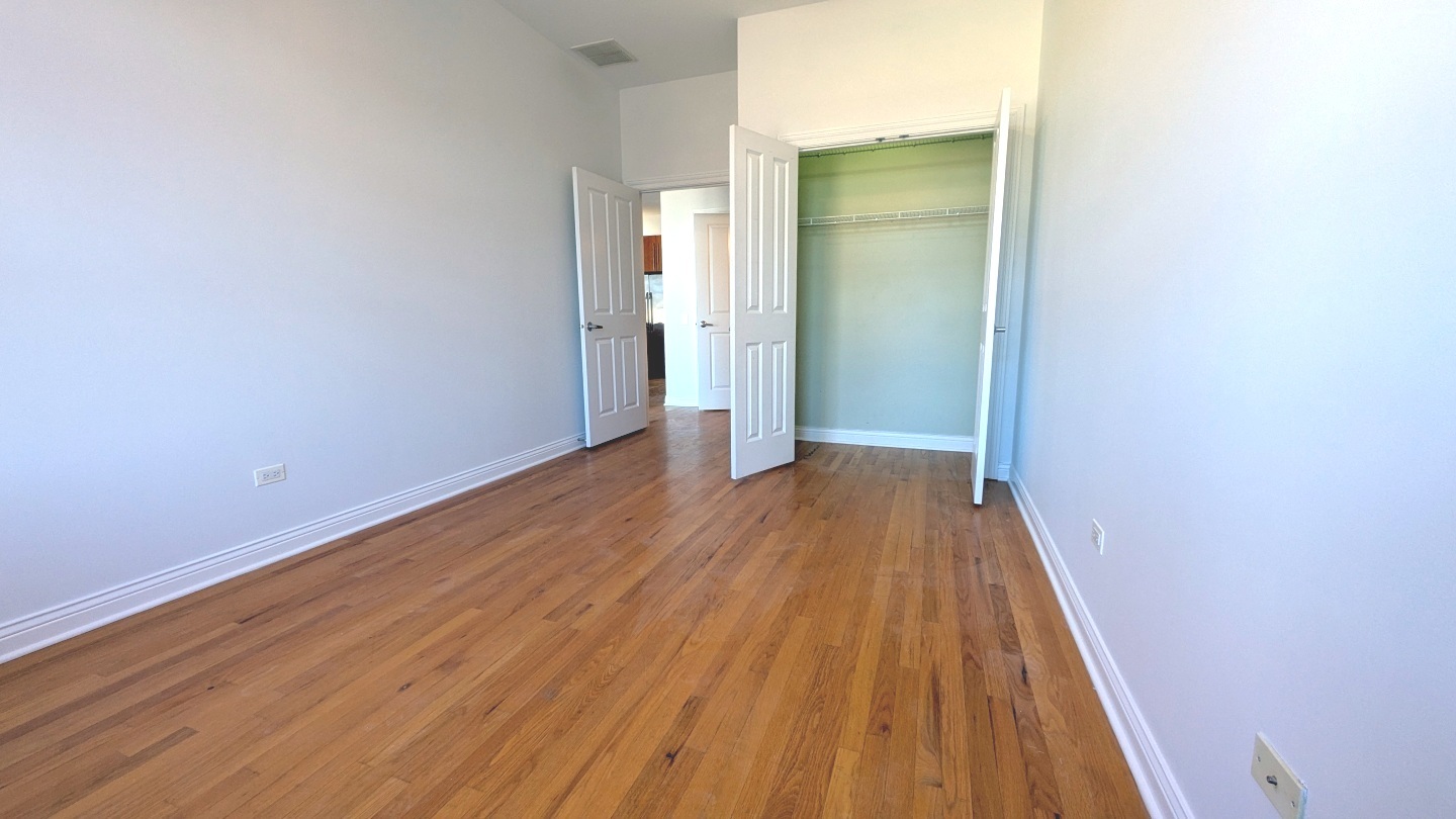 1355 West Washington Boulevard, Unit 6B Chicago, IL 60607 - Photo 20 of 28 wooden floor in a empty room