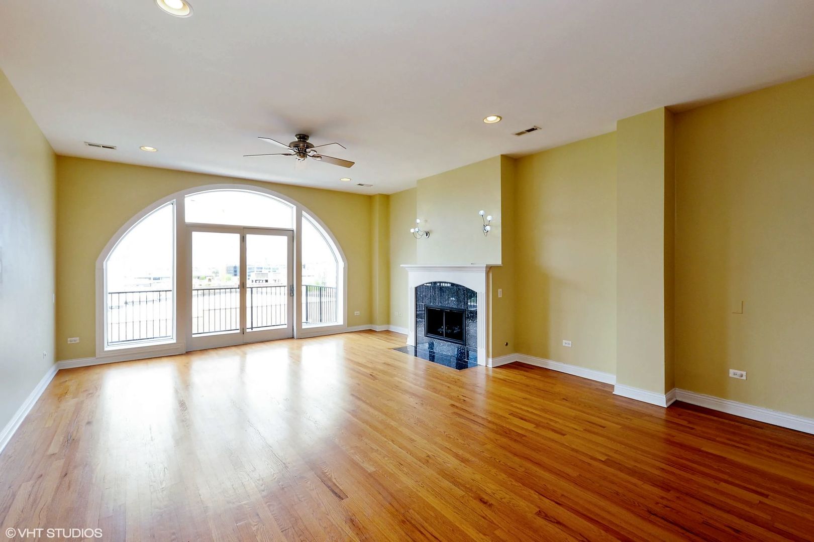 1355 West Washington Boulevard, Unit 6B Chicago, IL 60607 - Photo 2 of 28 a view of an empty room with a window and wooden floor