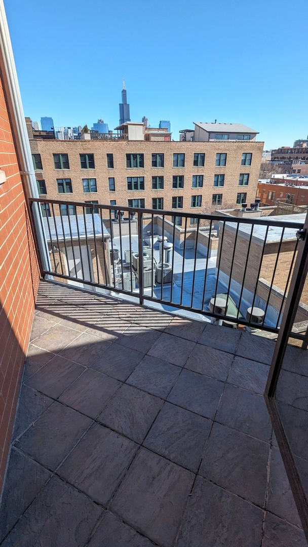 1355 West Washington Boulevard, Unit 6B Chicago, IL 60607 - Photo 24 of 28 a view of a balcony with an outdoor space