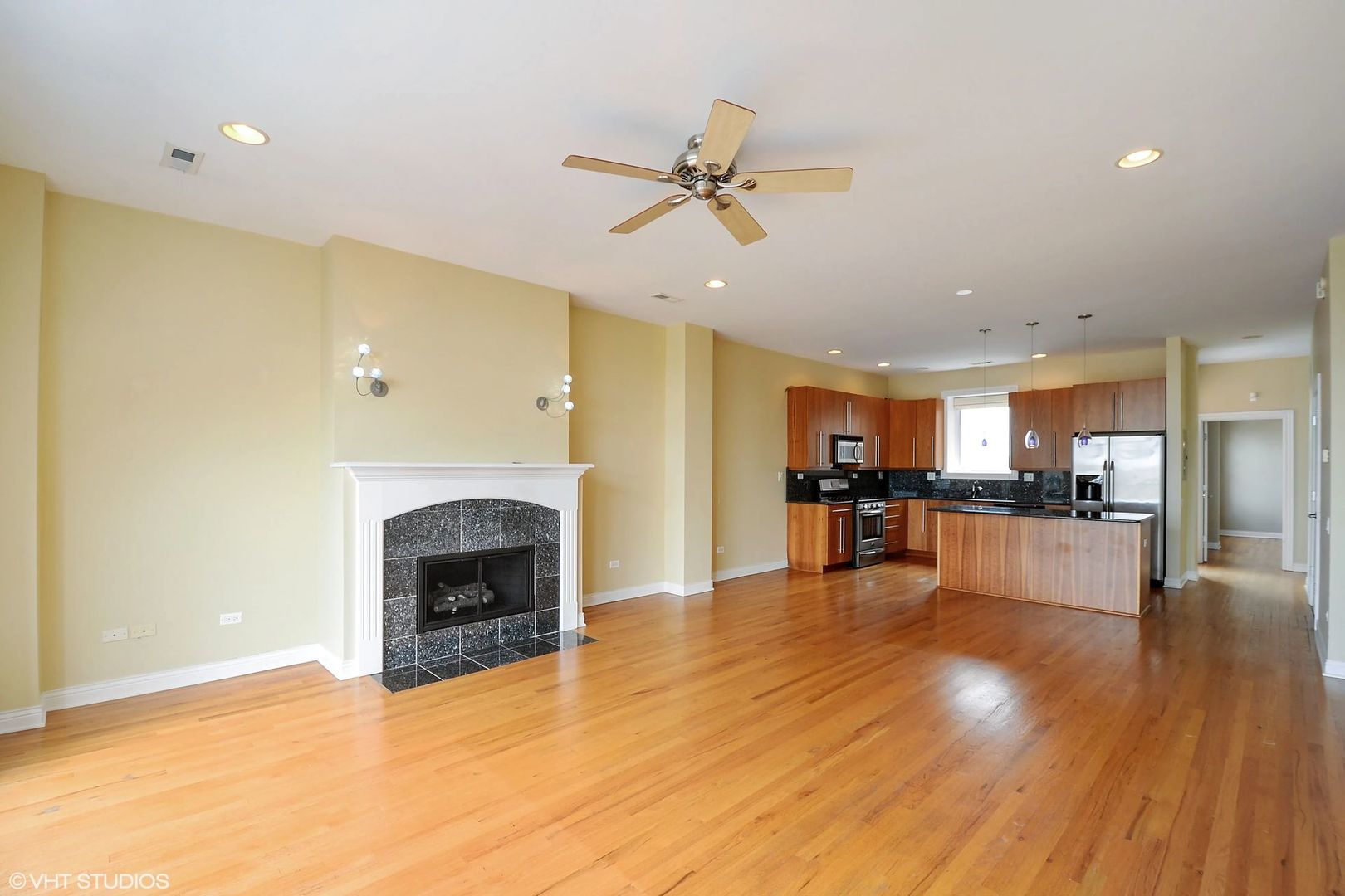 1355 West Washington Boulevard, Unit 6B Chicago, IL 60607 - Photo 3 of 28 a view of a kitchen with a sink and a fireplace