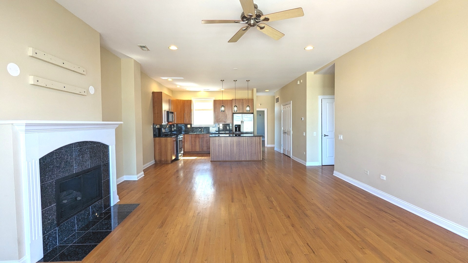 1355 West Washington Boulevard, Unit 6B Chicago, IL 60607 - Photo 4 of 28 a view of a living room with furniture and a fireplace