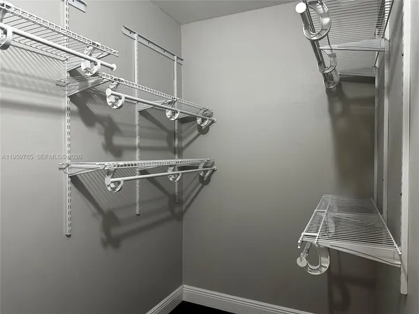 a view of a room with racks on the wall