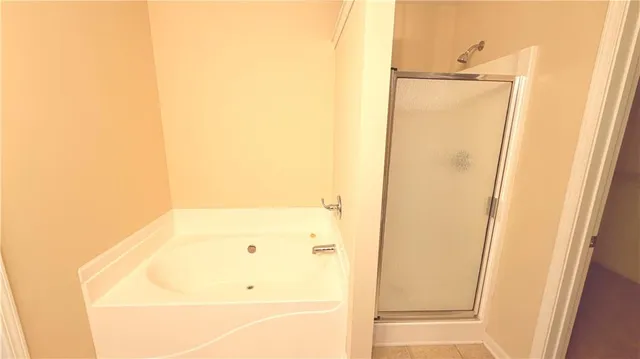 a bathroom with a glass shower door