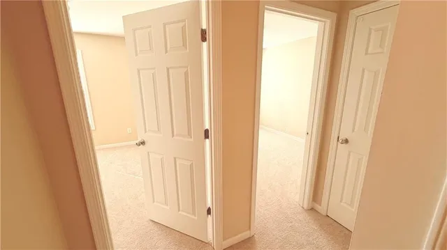 a view of a bathroom from the door