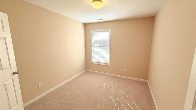 a view of an empty room with window