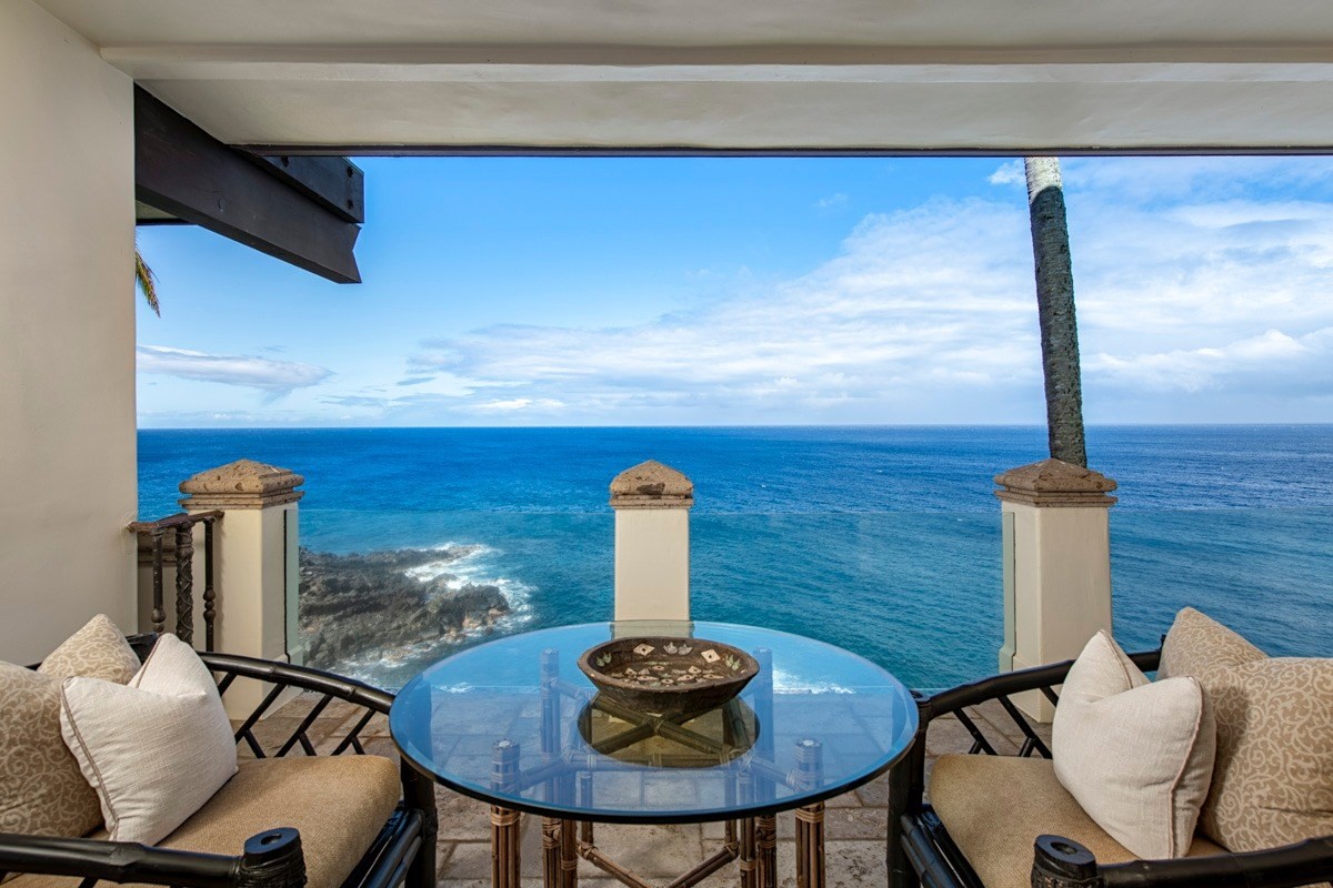 56-3083 Puakea Bay Road Kamuela, HI 96743 - Photo 15 of 30 a table with a fireplace and a chair