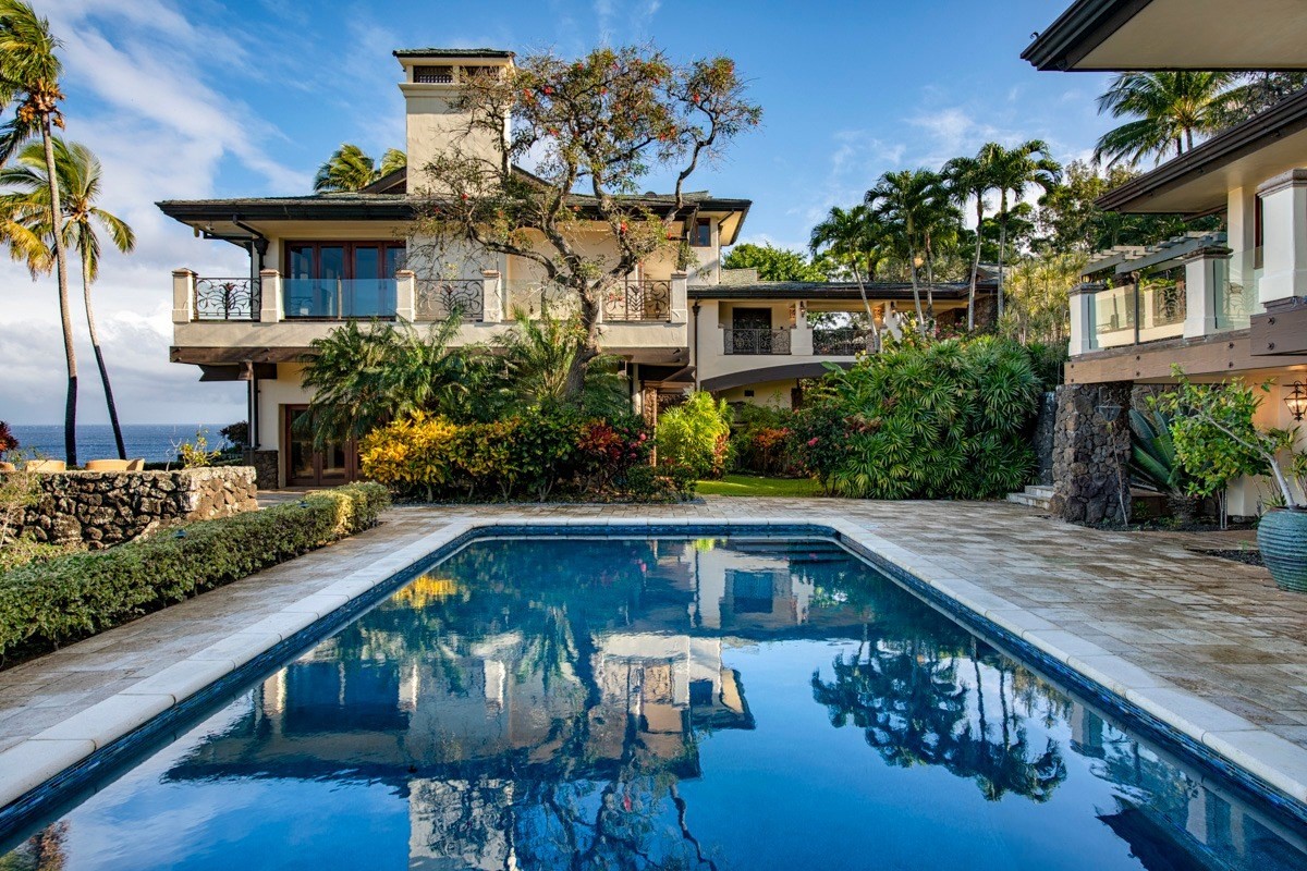 56-3083 Puakea Bay Road Kamuela, HI 96743 - Photo 2 of 30 a view of a house with pool and chairs