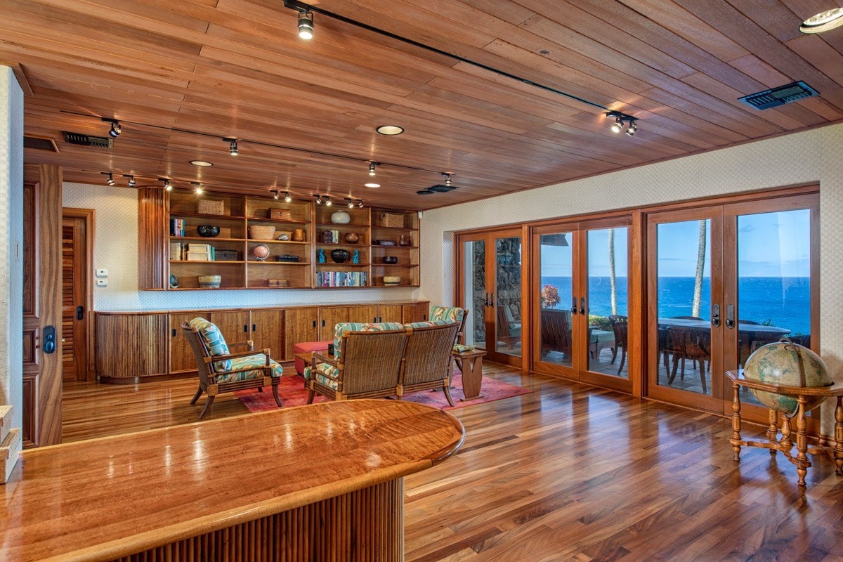 56-3083 Puakea Bay Road Kamuela, HI 96743 - Photo 25 of 30 a indoor swimming pool with lawn chairs and wooden floor