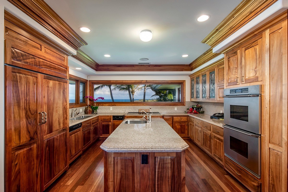 56-3083 Puakea Bay Road Kamuela, HI 96743 - Photo 26 of 30 a kitchen with stainless steel appliances granite countertop a stove and a refrigerator
