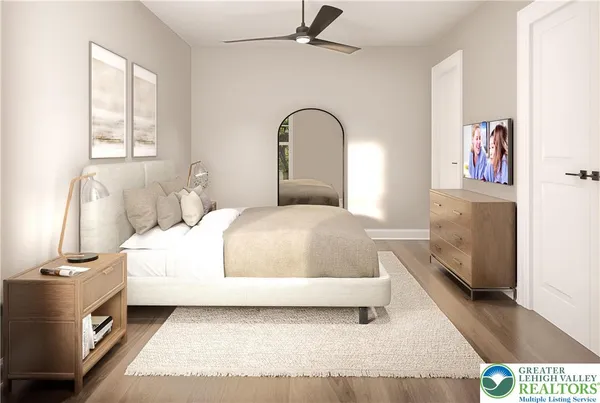 a bedroom with a bed and a large window