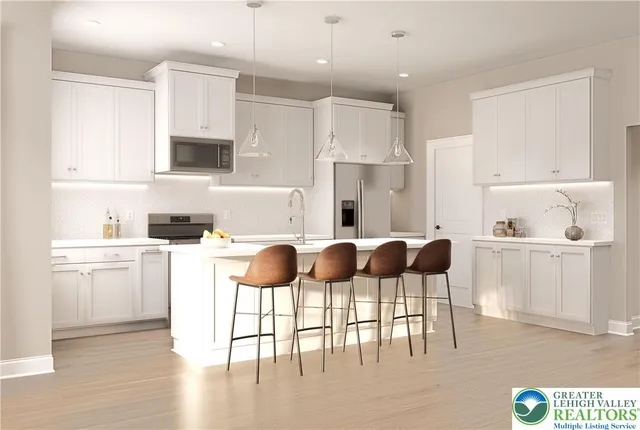 a kitchen with a sink cabinets and refrigerator