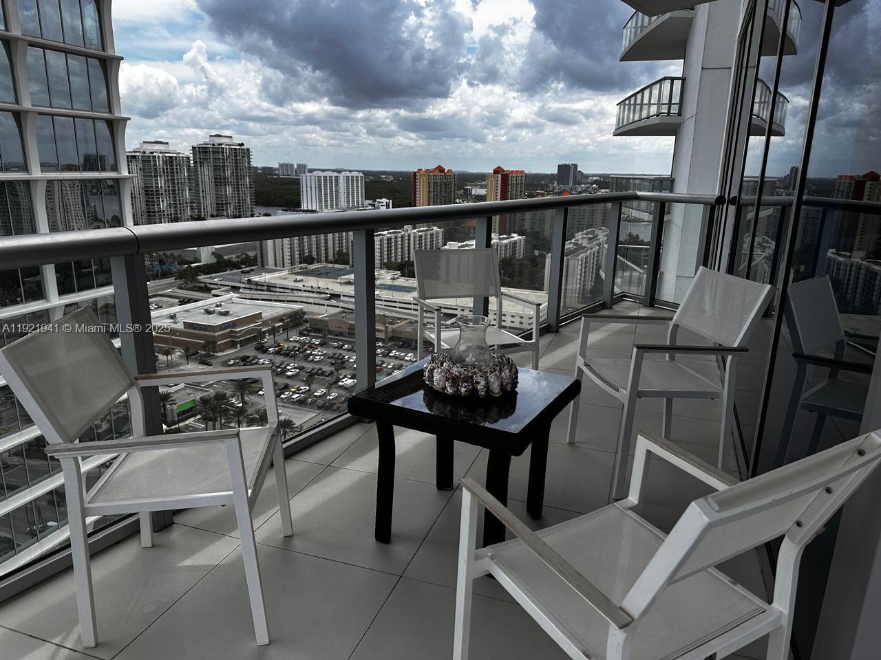17001 Collins Avenue, Unit 2601 Sunny Isles Beach, FL 33160 - Photo 21 of 27 a view of a balcony with furniture