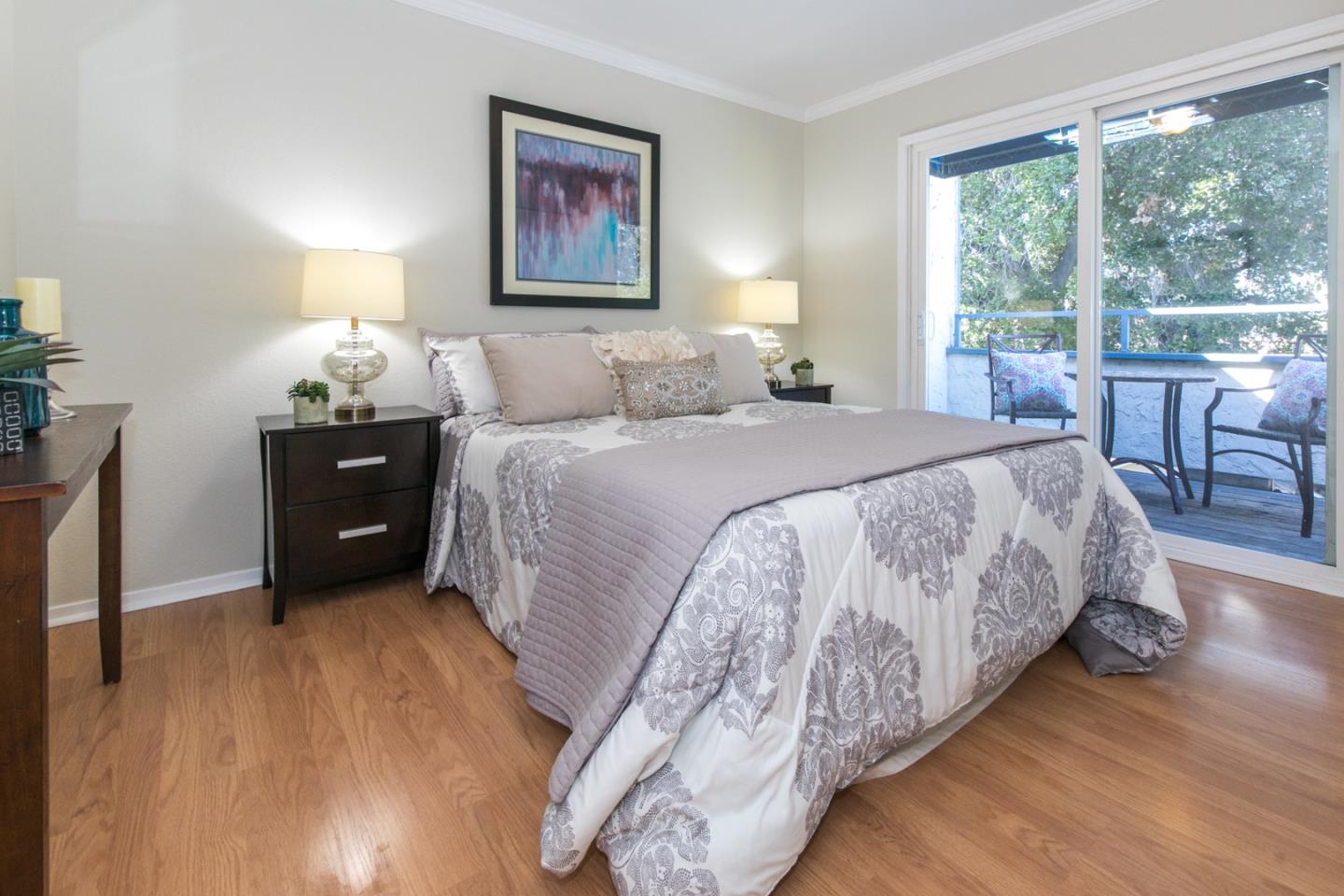 77 Redding Road Campbell, CA 95008 - Photo 14 of 22 a bedroom with a bed and a lamp on dresser with a large window