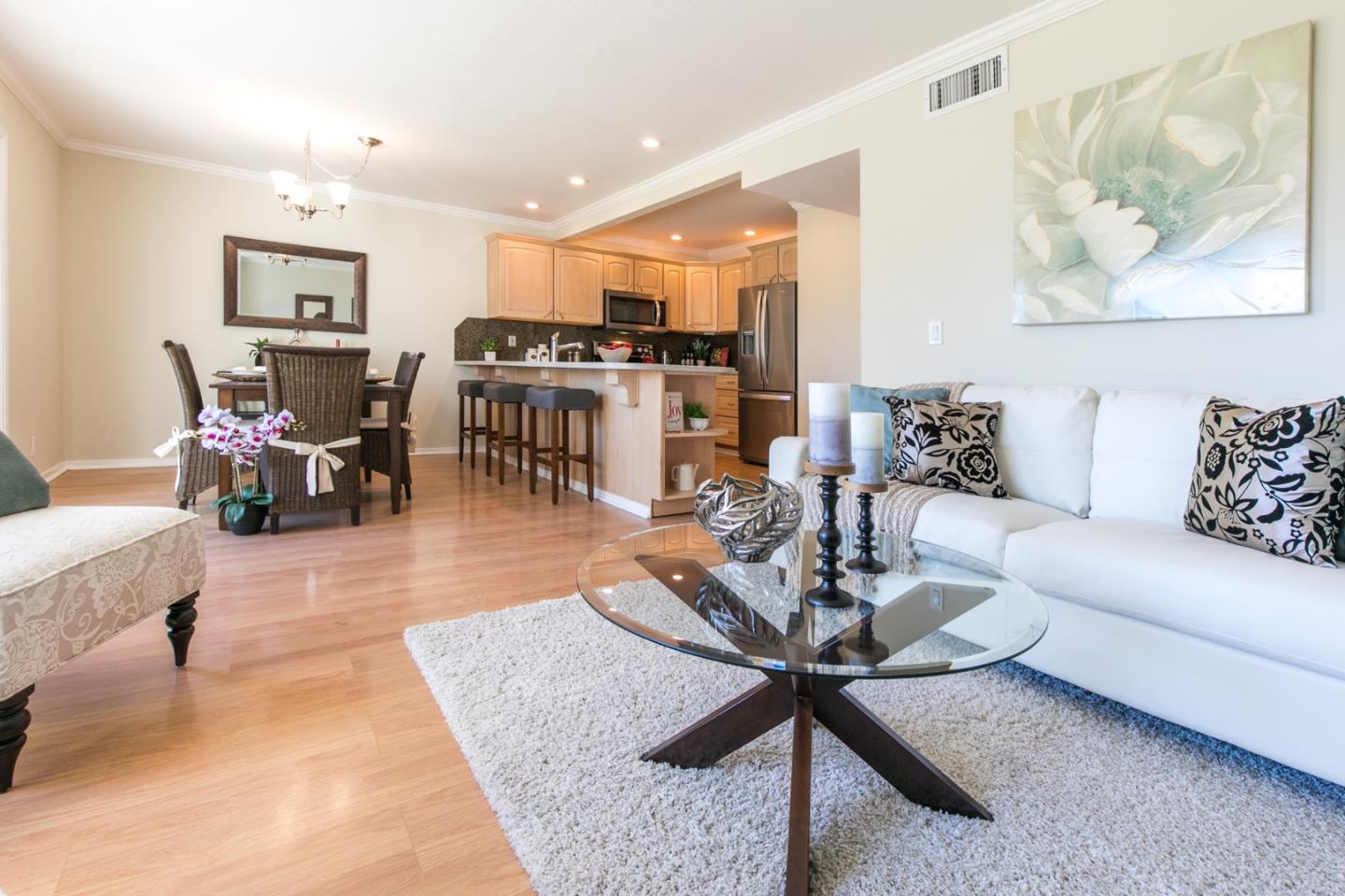 77 Redding Road Campbell, CA 95008 - Photo 3 of 22 a living room with furniture kitchen view and a chandelier