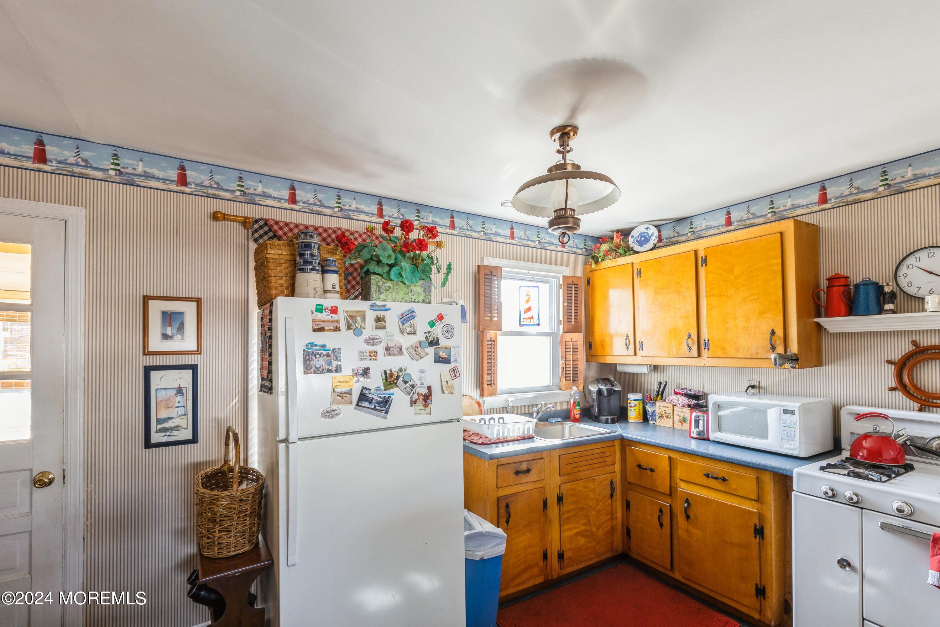 121 Montclair Road North Barnegat, NJ 08005 - Photo 10 of 15 a kitchen that has a lot of cabinets a sink and a window