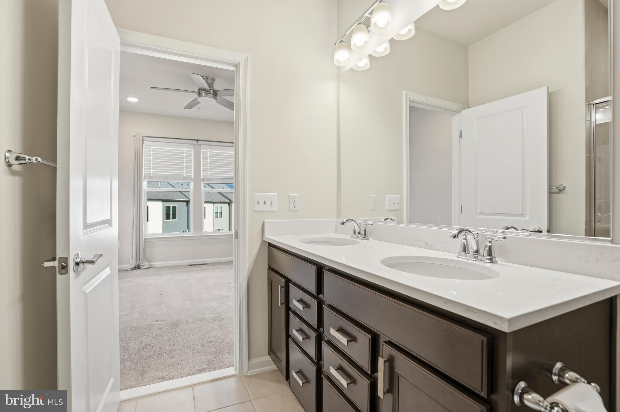 211 Narrowleaf Way Laurel, MD 20724 - Photo 18 of 36 a bathroom with a sink double vanity and a mirror