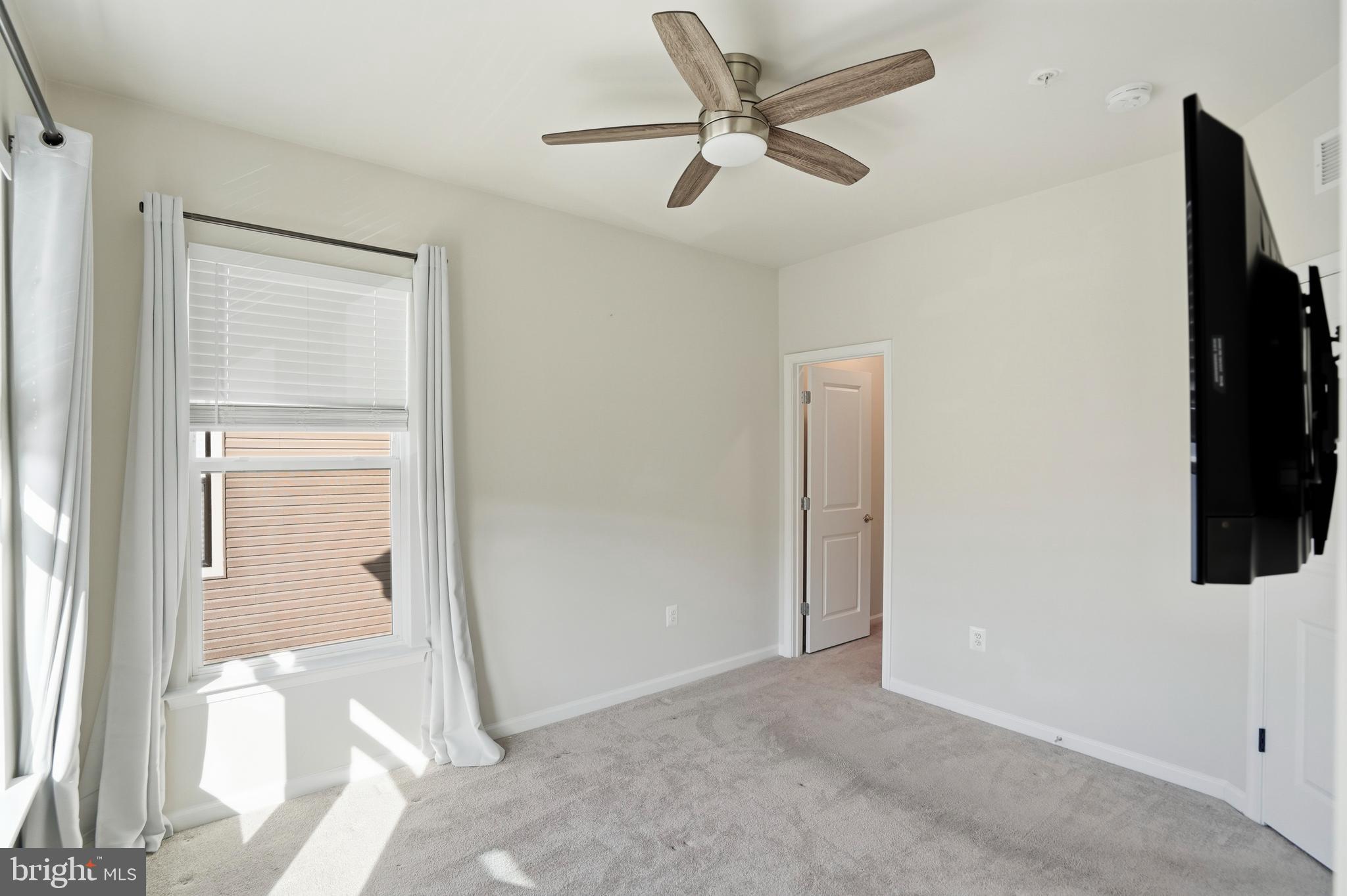 211 Narrowleaf Way Laurel, MD 20724 - Photo 23 of 36 a view of a livingroom with a flat screen tv