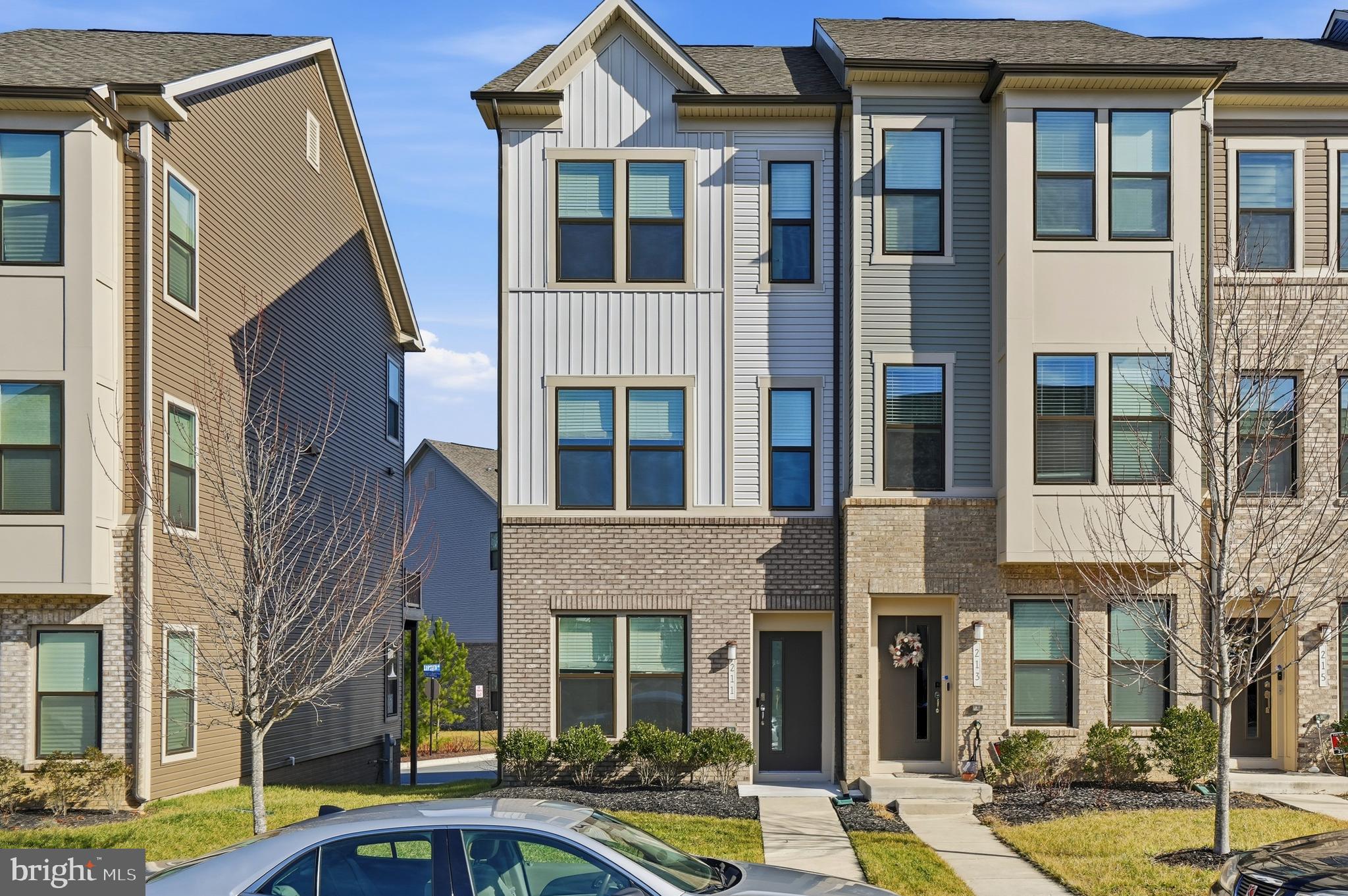 211 Narrowleaf Way Laurel, MD 20724 - Photo 31 of 36 a front view of a building with a lot of windows and plants