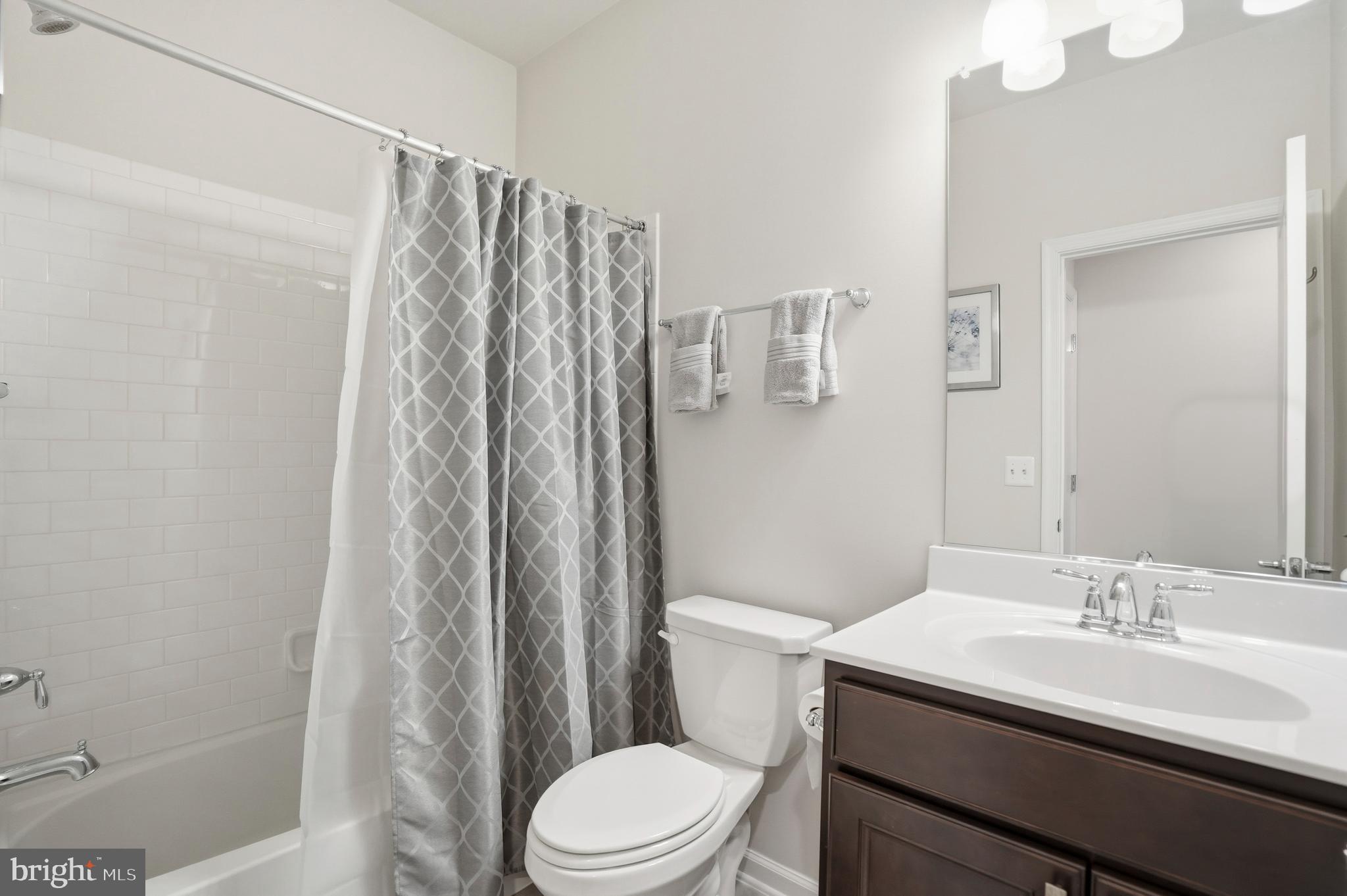 211 Narrowleaf Way Laurel, MD 20724 - Photo 6 of 36 a bathroom with a sink toilet and shower