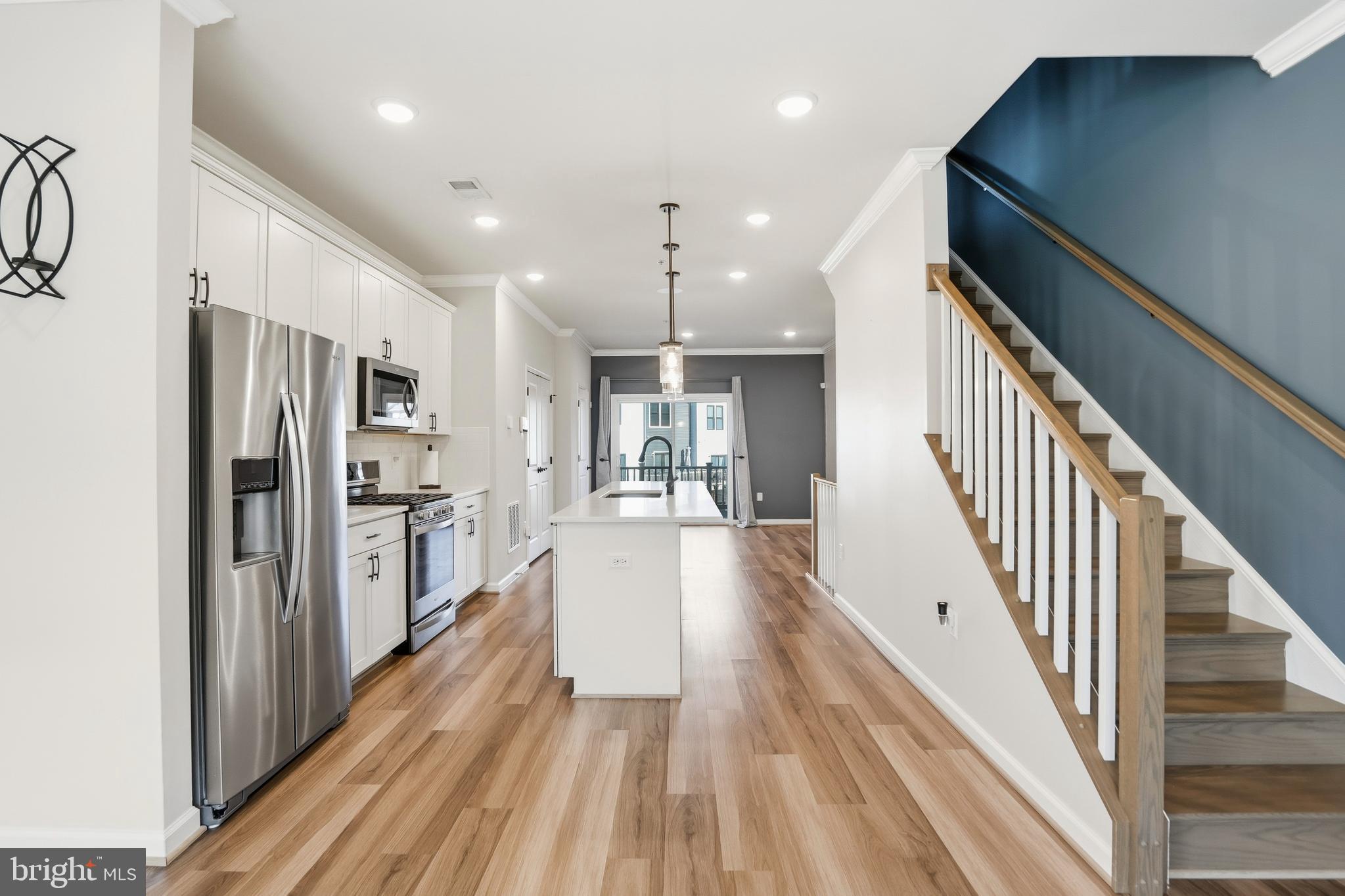 211 Narrowleaf Way Laurel, MD 20724 - Photo 7 of 36 a view of a hallway with wooden floor and staircase