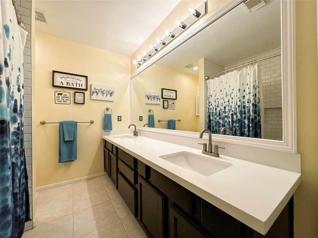 5202 Spring Cir Drive Pearland, TX 77584 - Photo 14 of 19 a spacious bathroom with a sink double vanity and a mirror