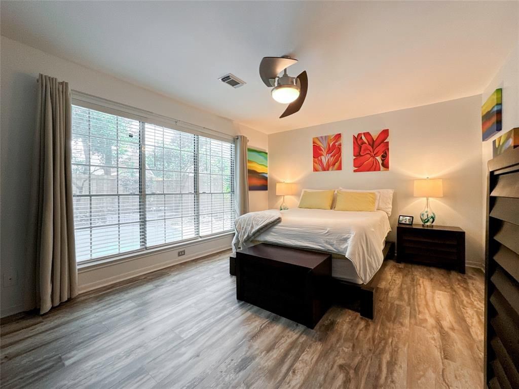 5202 Spring Cir Drive Pearland, TX 77584 - Photo 8 of 19 a bedroom with a bed and a large window