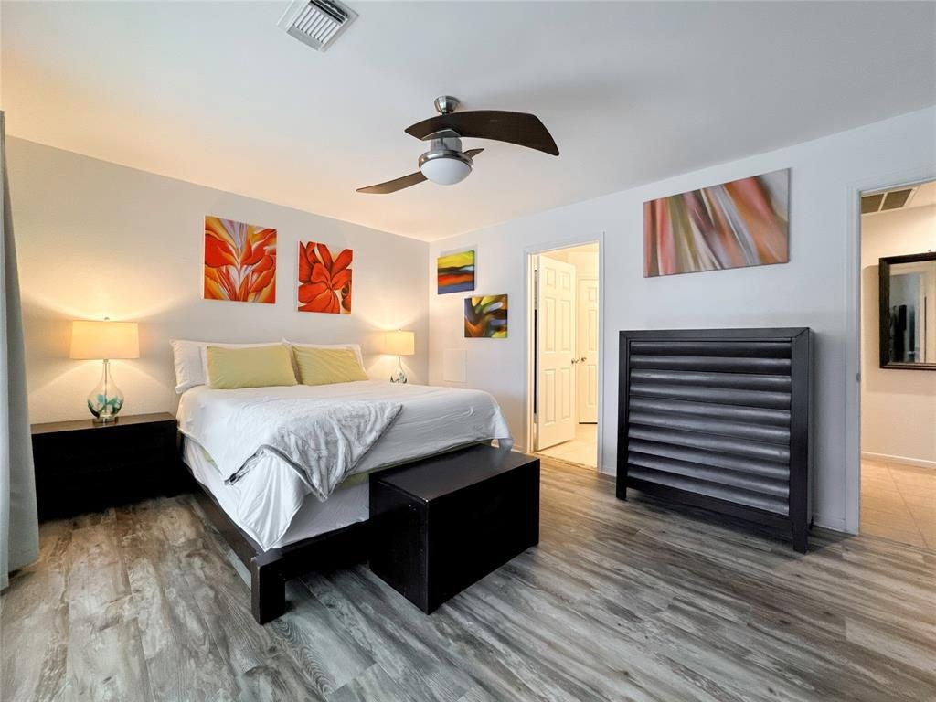 5202 Spring Cir Drive Pearland, TX 77584 - Photo 9 of 19 a bedroom with a bed and wooden floor