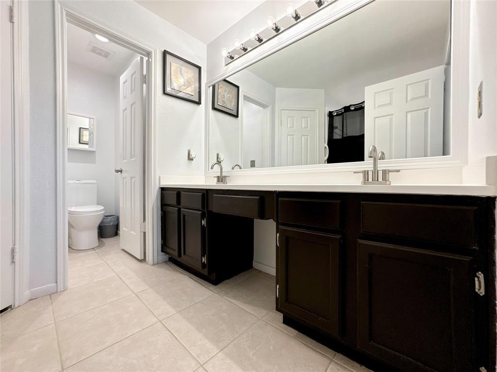 5202 Spring Cir Drive Pearland, TX 77584 - Photo 10 of 19 a spacious bathroom with a double vanity sink and mirror