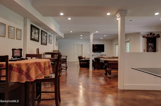 a living room with furniture and kitchen view