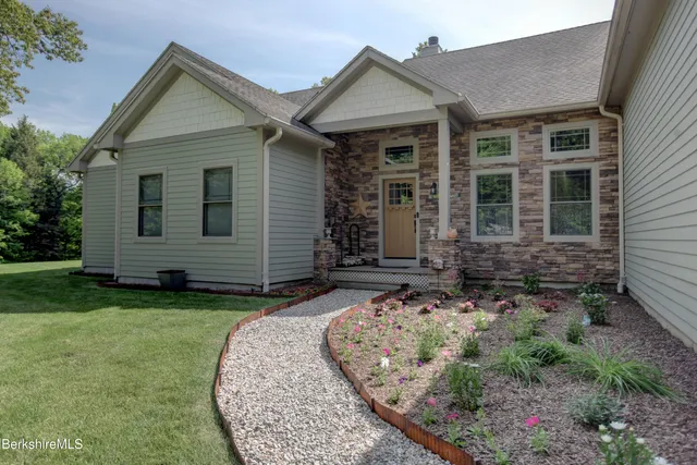 front view of a house with a yard