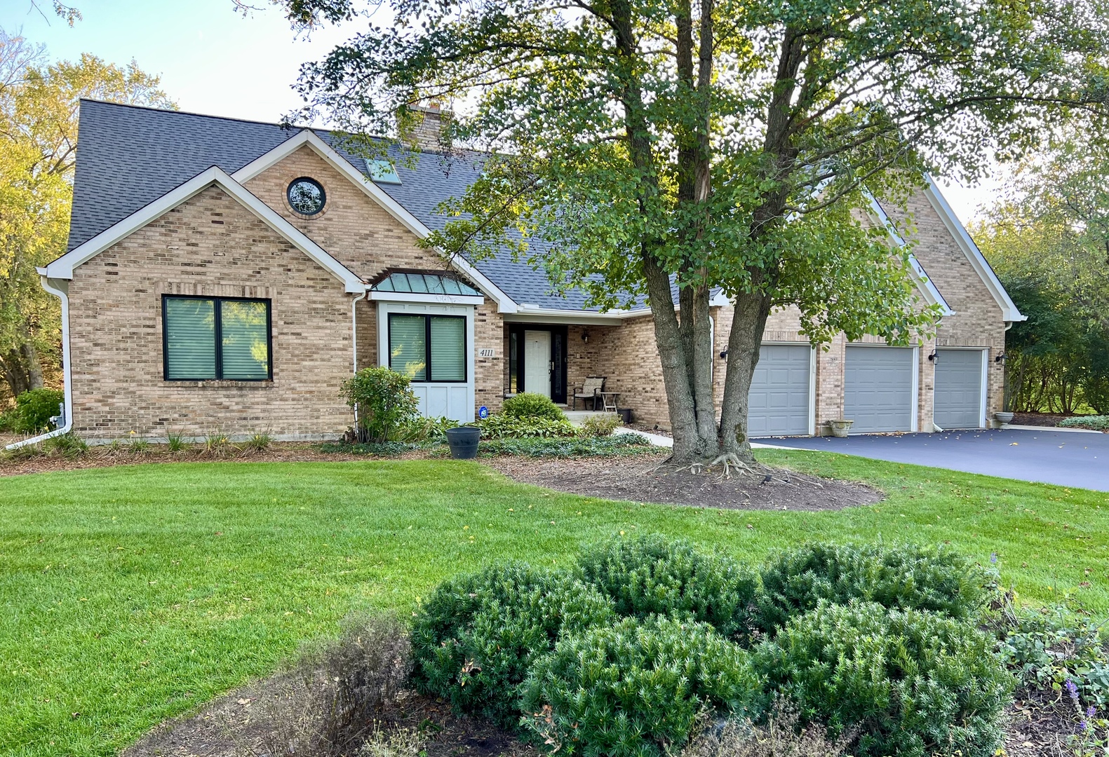 4111 Steeple Run Crystal Lake, IL 60014 - Photo 1 of 50 a front view of a house with garden